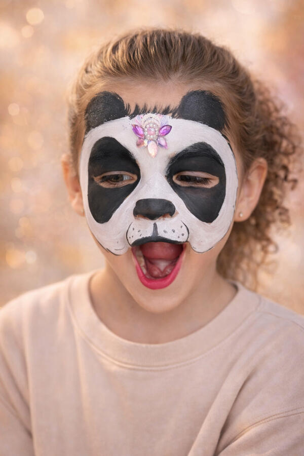 Panda face painting with bling