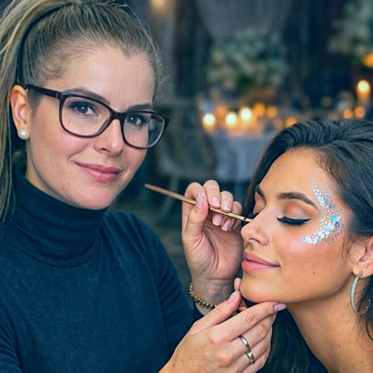 Berni the face painter and her festival glitter art